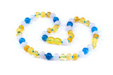 Natural amber necklace for kids showcasing warm amber tones with blue and green gemstone beads