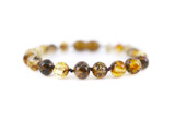 Greenish Baltic amber teething anklet for kids with individually knotted baroque beads and cotton cord