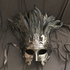 Roman mask with feathers