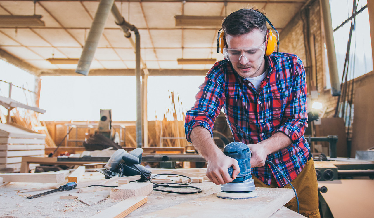 Man sanding wood
