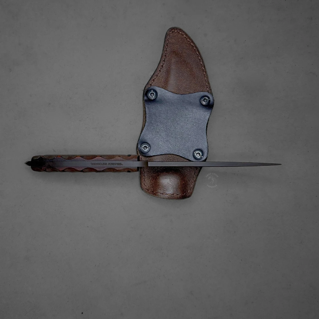 used Winkler drop point crusher knife