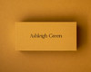 Mustard place card printed in black ink, showcasing custom name cards for modern wedding table décor.