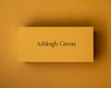 Mustard place card printed in black ink, showcasing custom name cards for modern wedding table décor.