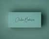 A personalised jade green place card printed in black ink in a delicate script font. The dark ink contrasts beautifully with the soft green backdrop, ideal for refined table settings or stylish event décor.