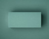 A close-up of a blank jade green flat place card, photographed on matching coloured paper. This image showcases the smooth matte finish and natural texture of the 300gsm cardstock — perfect for elegant table styling at weddings, events or private dinners.