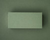 A blank olive green flat place card displayed against a matching olive green background.