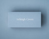 A personalised Dusty Blue place card featuring white ink printing, offering a clean and elegant alternative for light script on coloured stock.