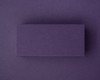 Blank aubergine flat place card made from 300gsm cardstock, displayed against a matching deep purple background.
