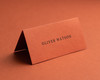 Personalised burnt orange folded place card with black ink printing