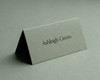 Personalised Sage Green folded place card with black ink name printing – elegant wedding and event stationery.