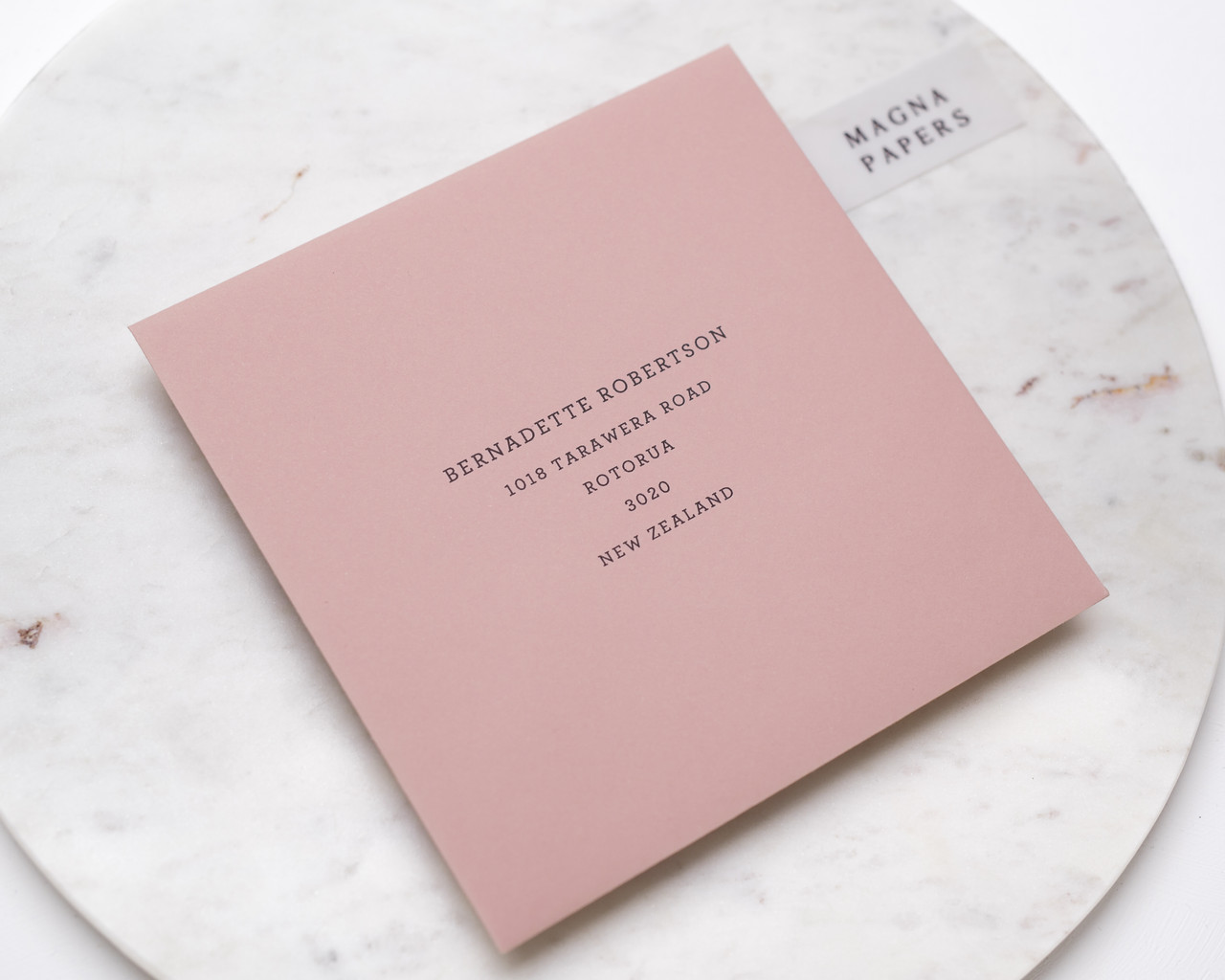 square blush pink envelopes