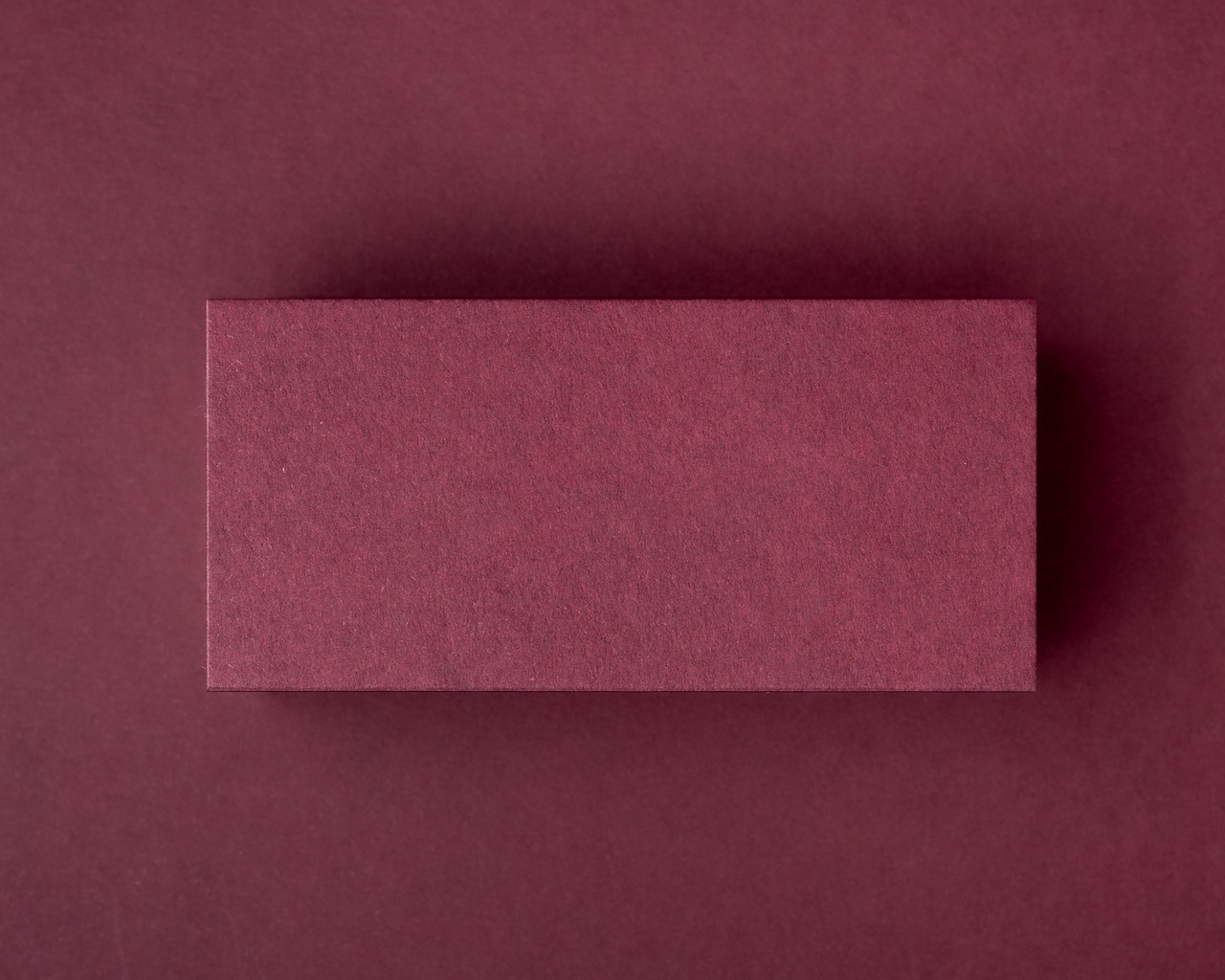 Flat burgundy place card with a minimalist blank design, perfect for custom handwritten or printed guest names at weddings or formal events.