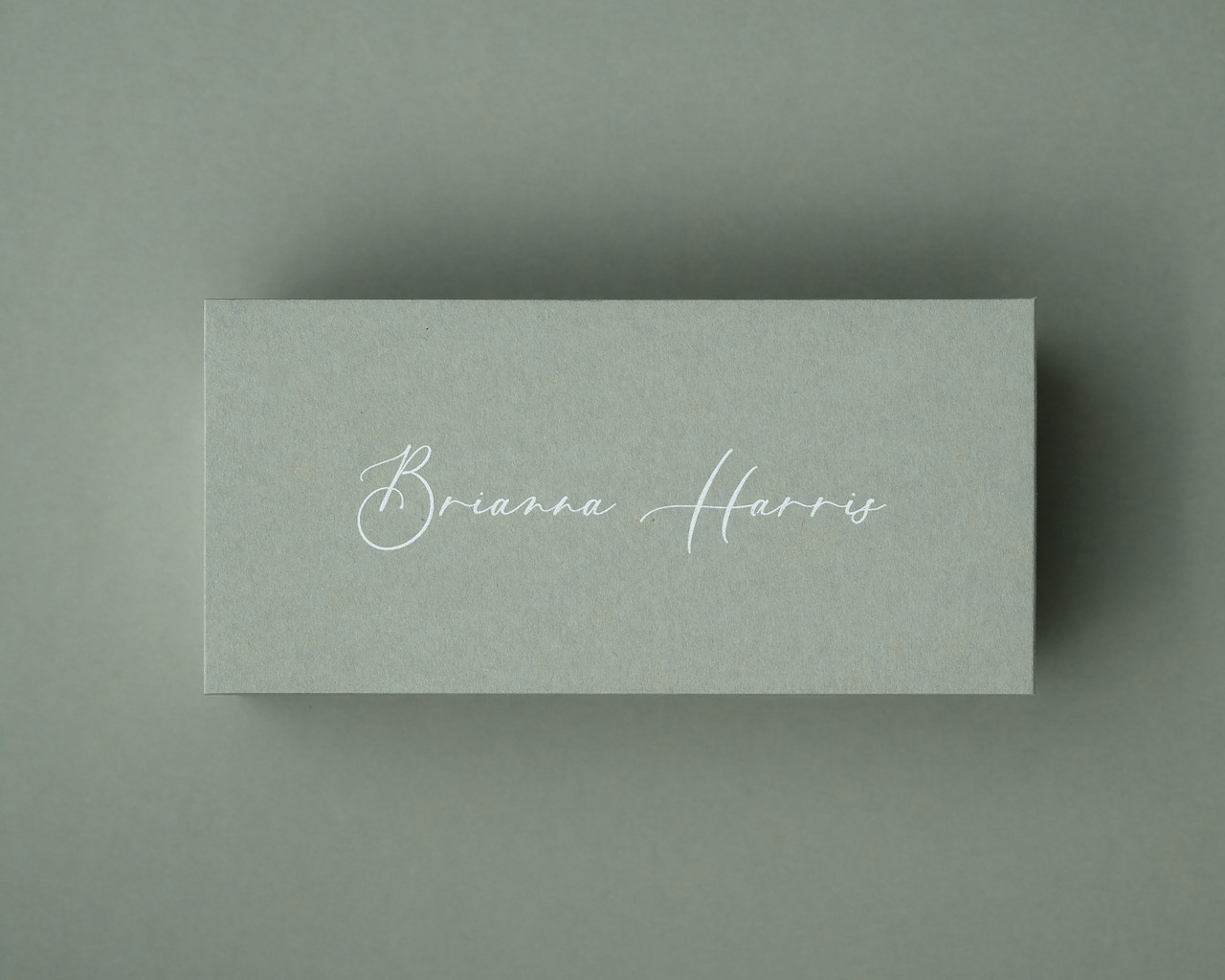 The Sage place card personalised with the name in white ink, offering a soft and elegant look ideal for minimalist or botanical themes.