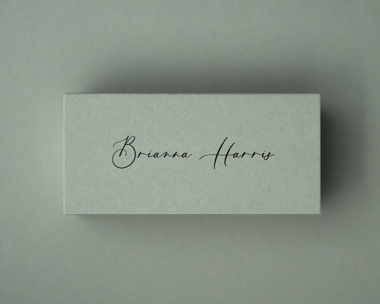 The same Sage Green card printed in black ink, showcasing a bold contrast that complements rustic or contemporary styling.