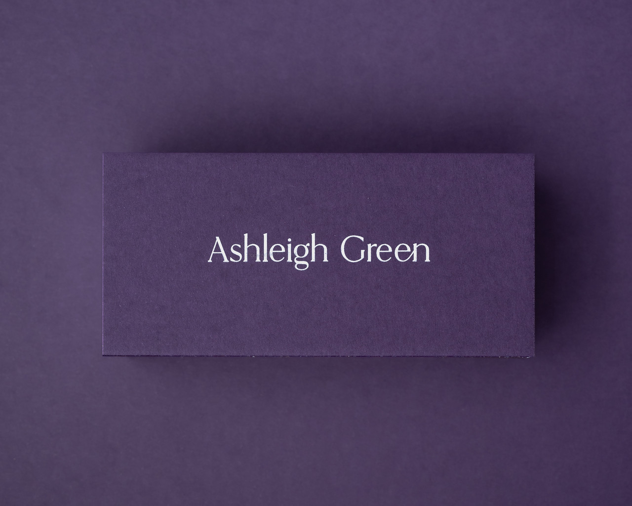 Personalised aubergine flat place card with a name elegantly printed in white ink on thick 300gsm card.