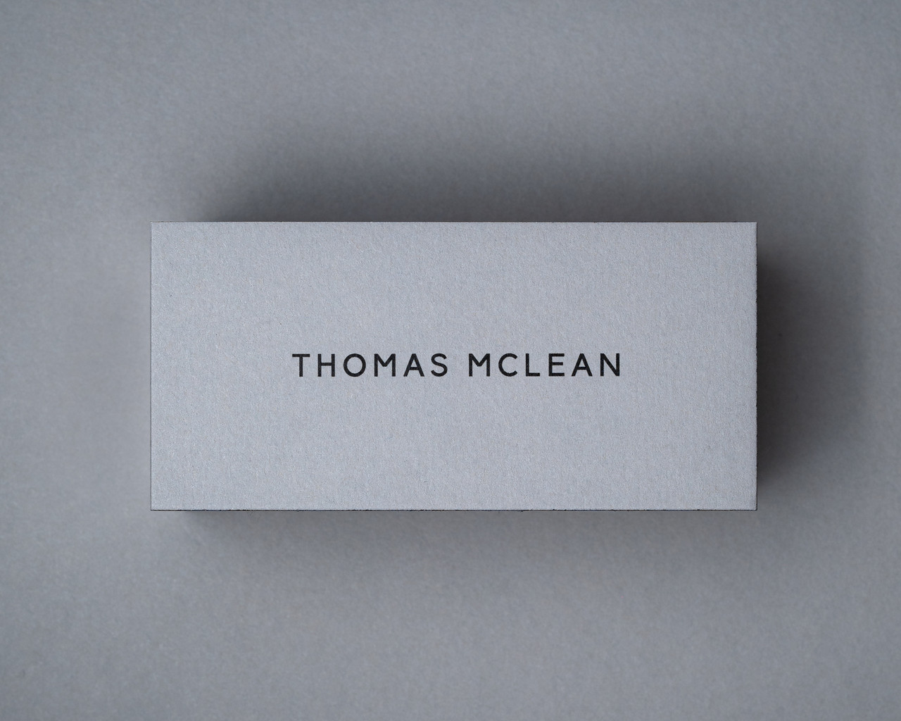Personalised mid grey flat place card with black ink printing for elegant table settings
