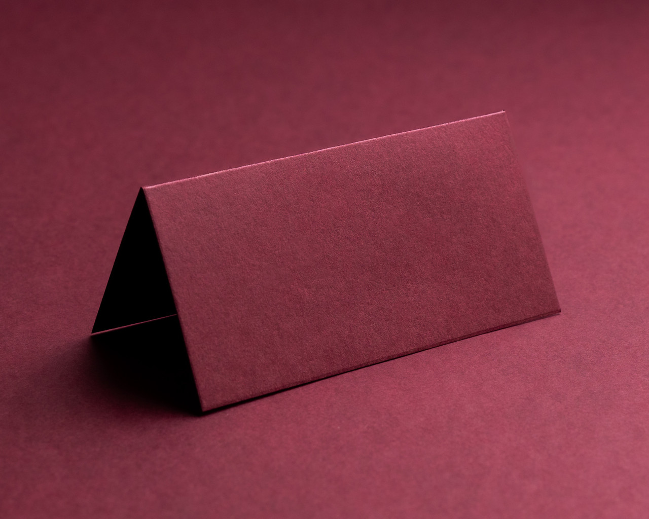 Blank folded burgundy place card made from luxury card stock, ready for personalisation