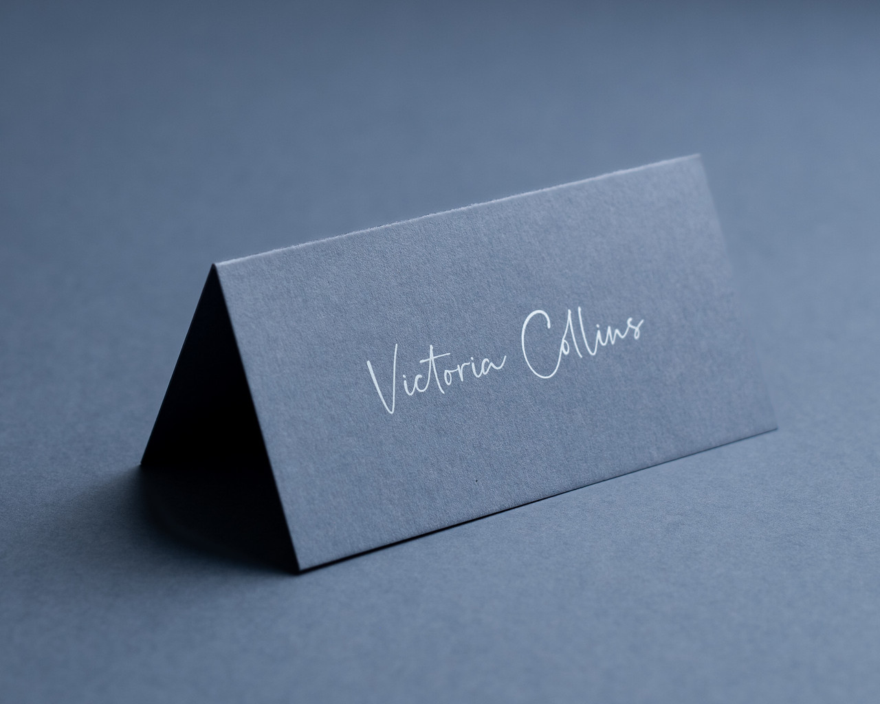 Personalised Airforce Blue place card with white ink printing on luxury 300gsm cardstock
