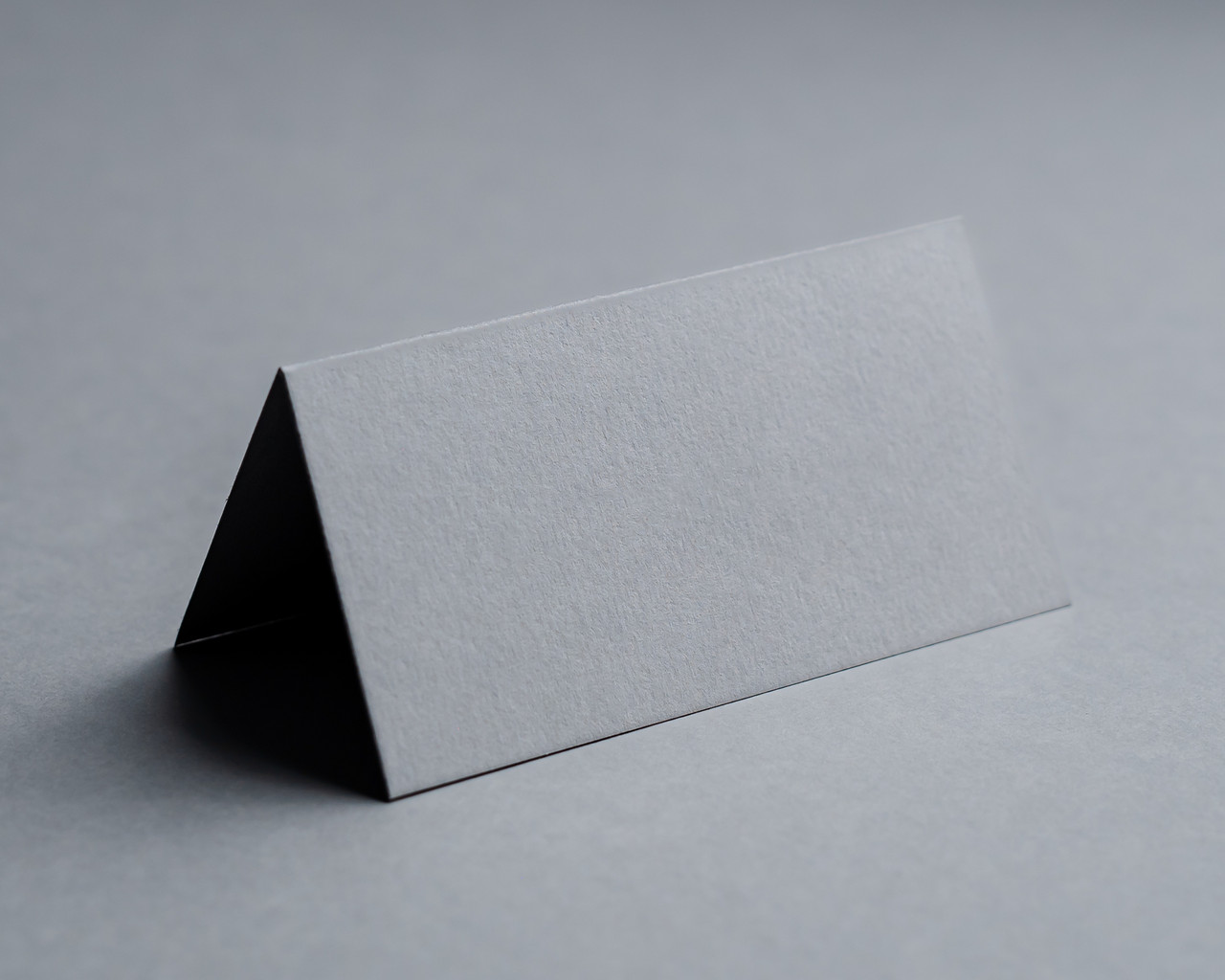 Blank mid grey folded place card on 270gsm card, supplied flat and scored for easy folding.