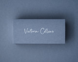 Personalised Airforce Blue place card printed in elegant white ink script, on premium 300gsm card.