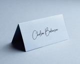 Powder blue folded place card printed in black ink, 250gsm premium card.