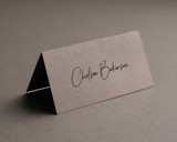 Mocha folded place card with black ink personalised name in modern calligraphy, premium 300gsm cardstock.