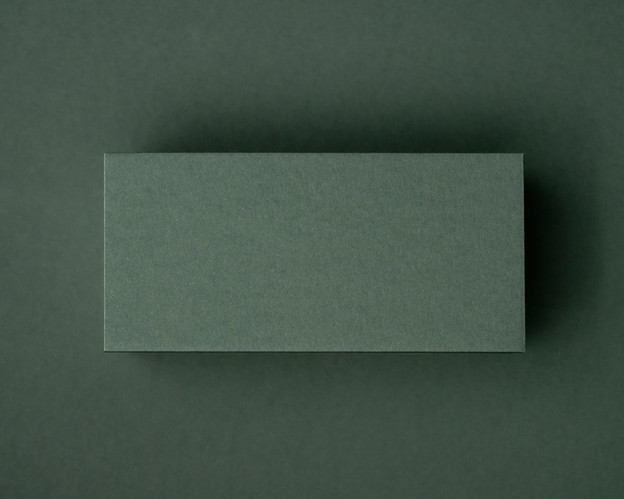 A blank khaki green flat place card displayed on a matching khaki background, highlighting its rich natural tone and thick 300gsm texture.