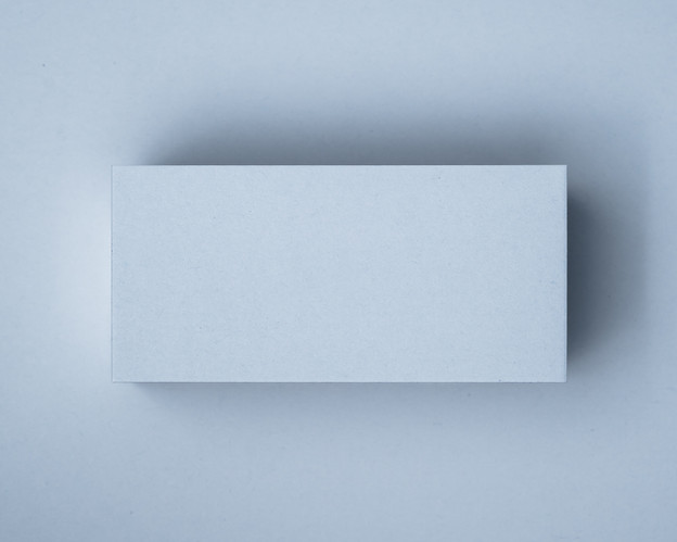 A blank Powder Blue flat place card on a matching blue background, showing the soft pastel tone and clean-cut edge.