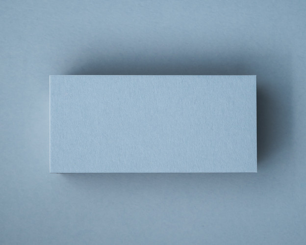 A blank Dusty Blue flat place card displayed on matching cardstock, showcasing the smooth texture and rich colour of the 300gsm paper.