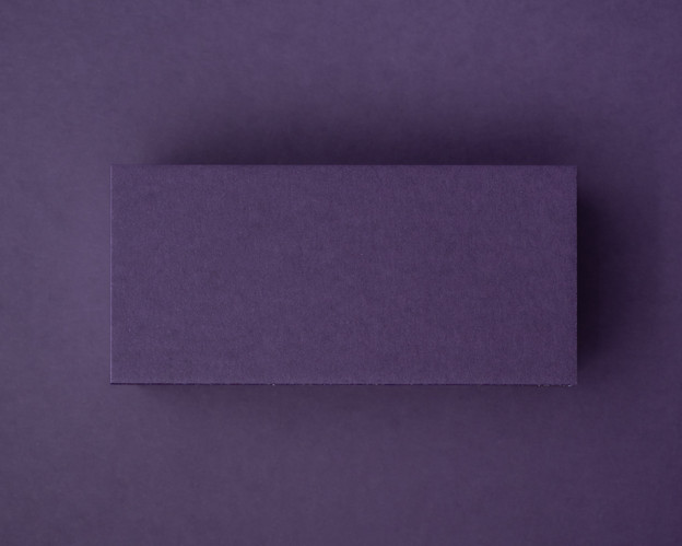 Blank aubergine flat place card made from 300gsm cardstock, displayed against a matching deep purple background.