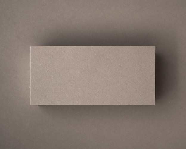 Blank mocha flat place card in premium 300gsm cardstock, displayed on a matching taupe background.