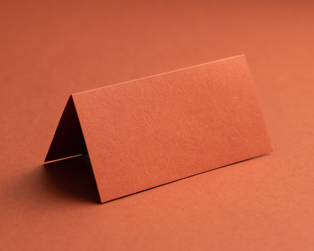 Blank burnt orange folded place card in premium card, ideal for weddings and events