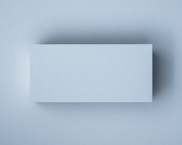 A blank Powder Blue flat place card on a matching blue background, showing the soft pastel tone and clean-cut edge.