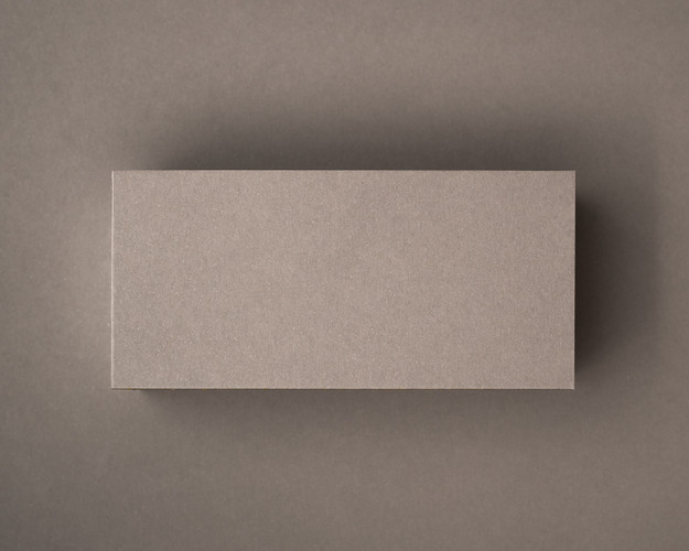 Blank mocha flat place card in premium 300gsm cardstock, displayed on a matching taupe background.