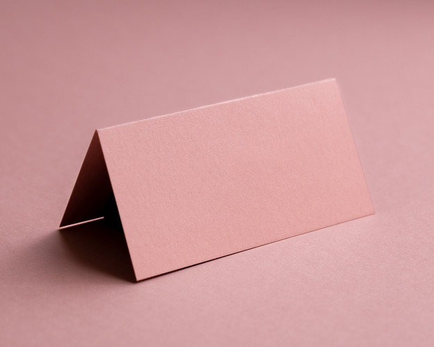 Blank blush pink folded place card made from premium 290gsm cardstock, ready for personalisation.