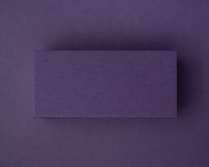 Blank aubergine flat place card made from 300gsm cardstock, displayed against a matching deep purple background.