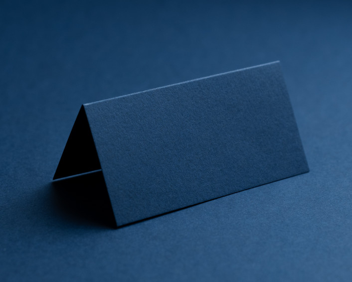 Blank navy folded place card, 270gsm or 350gsm card, supplied scored and flat for easy folding.