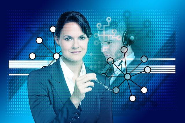 Man and woman data center managers.  Happy with UL approved racks.