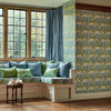 Morris & Co The Savaric Wallpaper 217340 Garden Green in a living room with window seat, blue cushions and wooden flooring