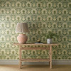 Morris & Co Iris & Rose Wallpaper Bayleaf Weld used in a living space with wooden console table, ceramic lamp and neutral interior styling