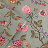Close-up of Laura Ashley Lingmell Trail wallpaper in Antique Green and rolled detail