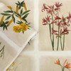 Close-up of Laura Ashley Pershore Postcards wallpaper showing floral illustrations and linen-effect background