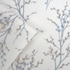 Close-up of Laura Ashley Pussy Willow wallpaper showing fine branch detailing and soft blue tones