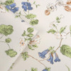 Close-up of Laura Ashley Pennywell Grove wallpaper showing painted floral detail and soft blue tones