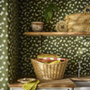 Room setting showing Little Greene Moon Daisies wallpaper in Olive, creating a warm and relaxed backdrop with a natural, garden-inspired feel