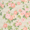Little Greene Rose Garden wallpaper in Green Stone, featuring soft pink roses and sage green foliage over a pale brick-effect background.