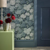 Detail view of Little Greene Rhododendron Walk wallpaper in Hicks’ Blue paired with blue woodwork and soft furnishings