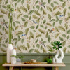 Crown Oakleigh Trail Natural wallpaper styled above green panelling with woodland birds and oak leaf design.
