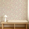 Scion Poppy Pod Wallpaper 113381 Lilac with large stylised floral motif in soft purple on a light background.