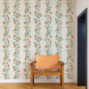 Scion On The Vine wallpaper in Tangerine and Kelly Green used in a neutral interior highlighting trailing foliage design.